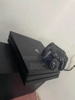 PS 4 Pro With All the Cables 2 Pads With a Charging Pot