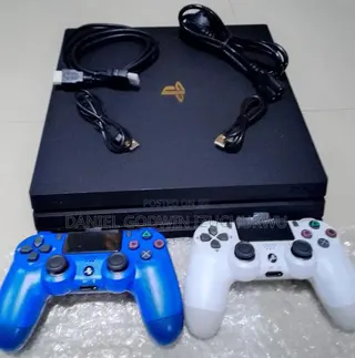 Uk Used Ps4 Pro 1terabyte, With 2 Controllers and 12 Games.