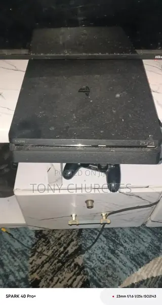 PS4 Slim With 3 Installed Games. FC 26, the Last of Us, and Other