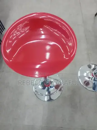 Red Bar Stool With Silver Base and Footrest .