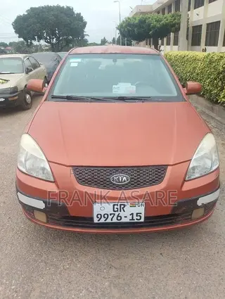 Kia Rio SX 4dr Sedan (1.6L 4cyl 4A) 2010 Orange
