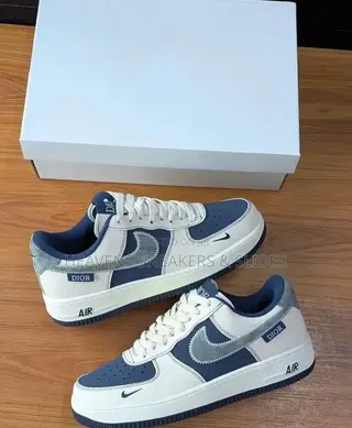 The Nike Air Force 1 X Dior Sneakers White and Navy Blue Colorway.