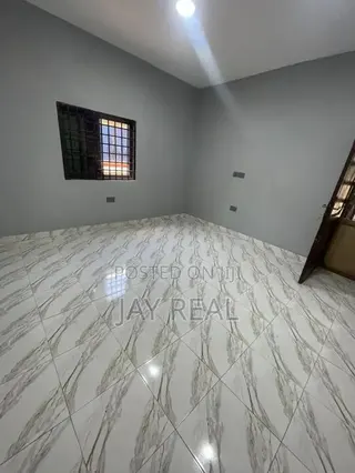 Road Side Plot With a Single Room Structure.