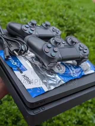 PS4 SLIM With 2 Controllers and 7 Games Including FC27