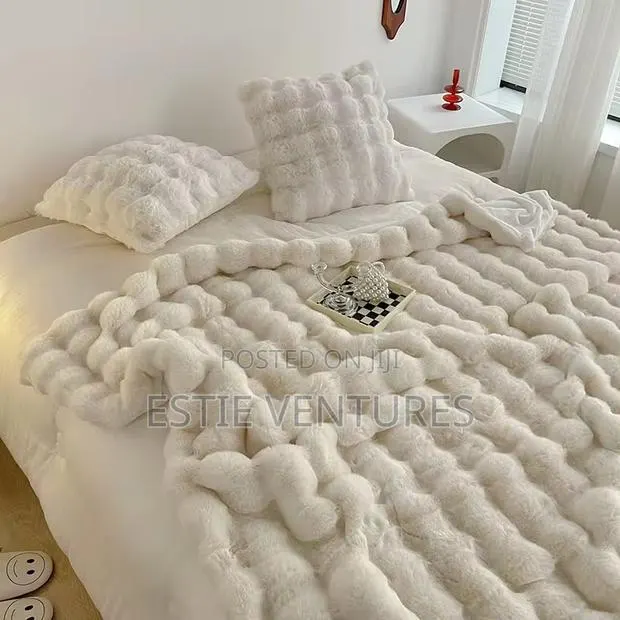 Blanket Features a Thick, Plush Texture Designed · Photo 1