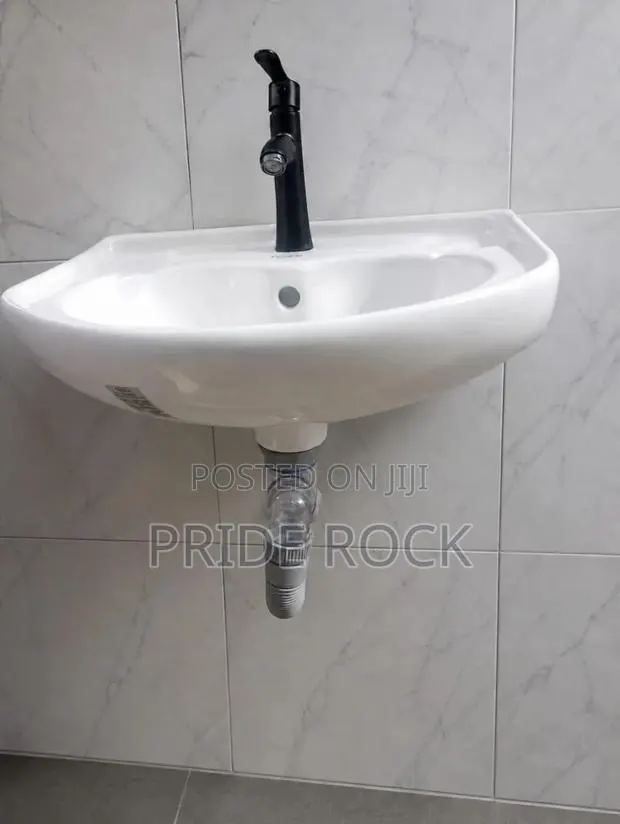 Hanging Wash Hand Basin Complete With Tap and Anti Odor Trap · Photo 1