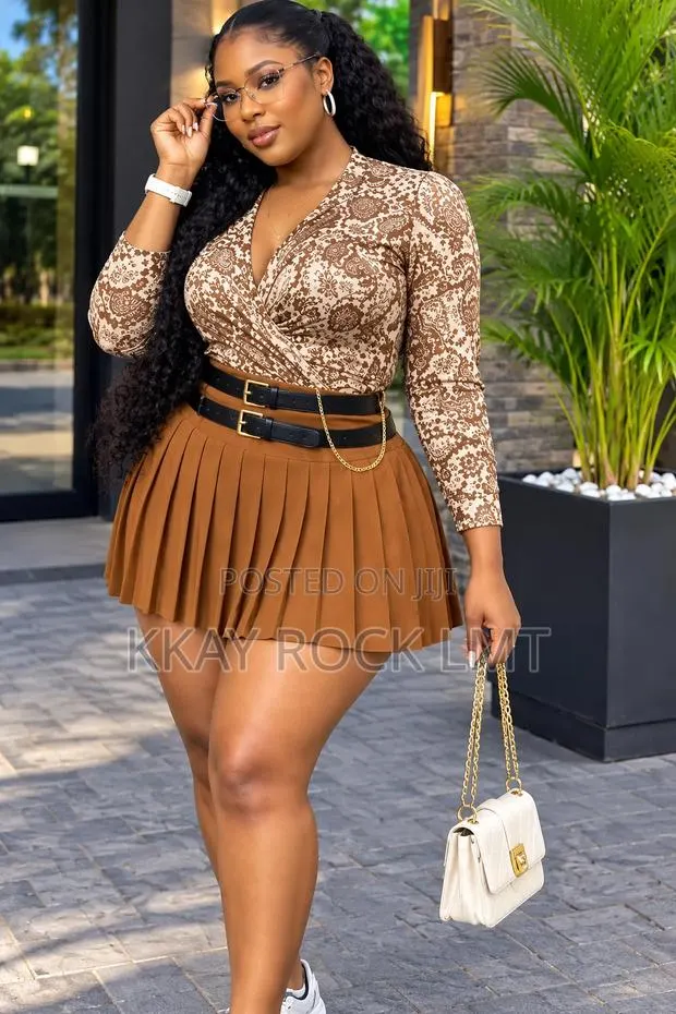 Elegant Pleated Skirt and Long Sleeve Top.