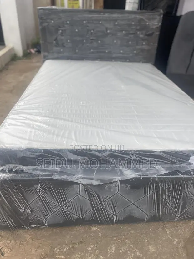 A Double Bed Frame With Mattress · Photo 1