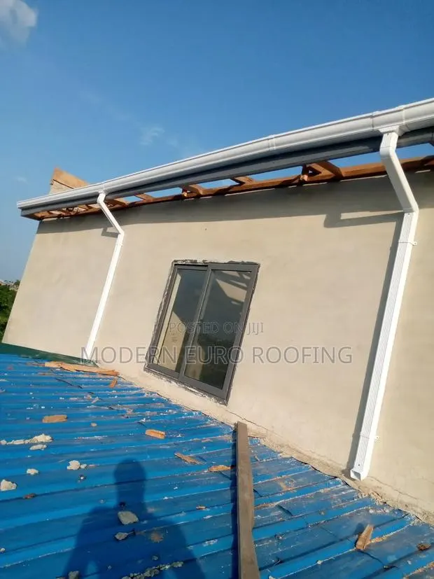 White PVC Rain Gutter and Down Pipe · Photo 1