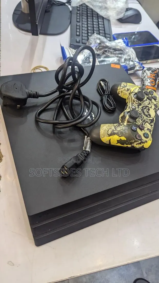 PlayStation 4 Pro Game With 2 Controllers, 17 Games and Charging Dock · Photo 1