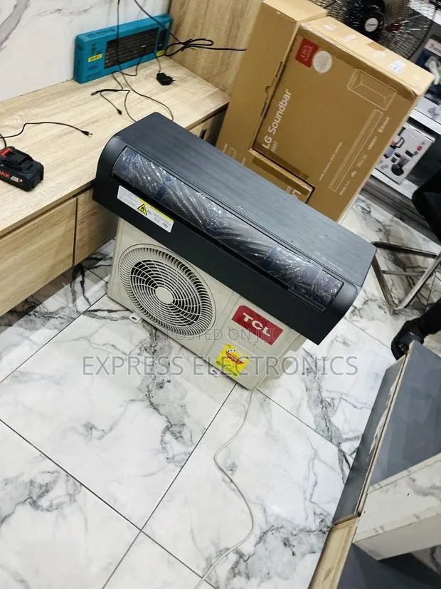 Available Now at Store TCL 1.5hp Split Inverter Dark Grey · Photo 1