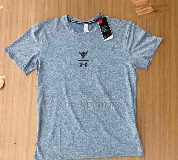 Under Amour Tops · Photo 1
