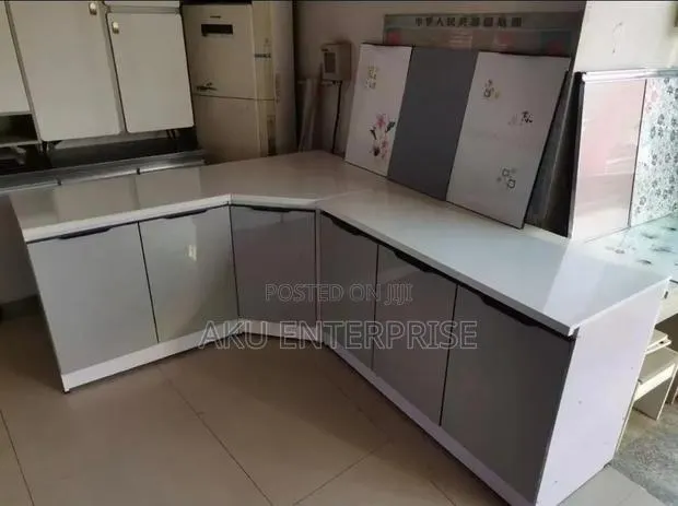 Kitchen Cabinet L Shaped With Marble Slab · Photo 1