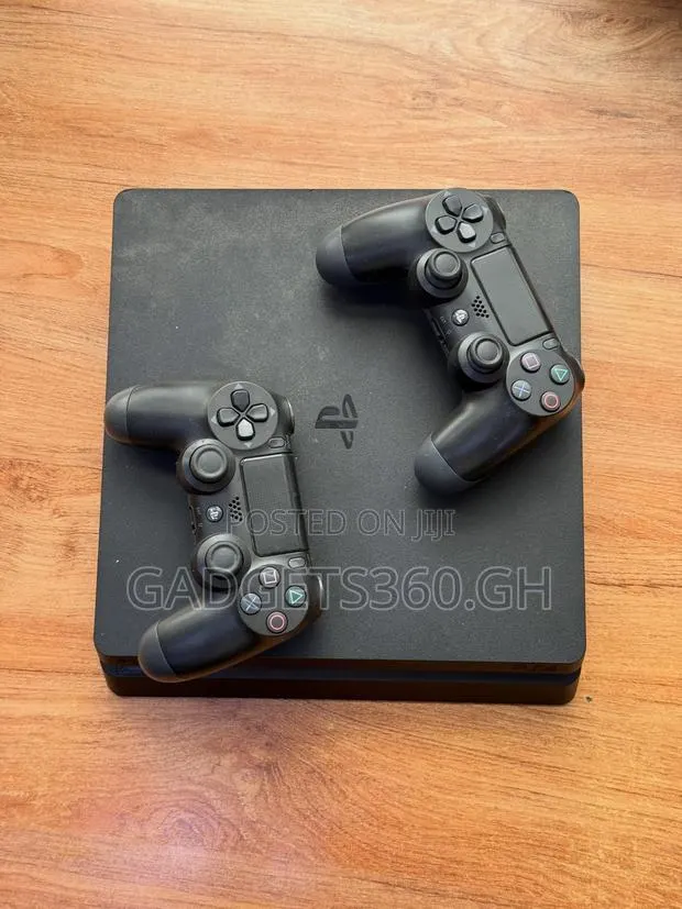 Sony PlayStation 4 Slim (1TB + 2 Controllers) · Photo 1