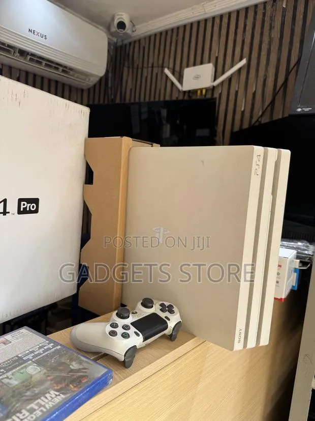 PS4 Pro 1TB (Used With Box) · Photo 1