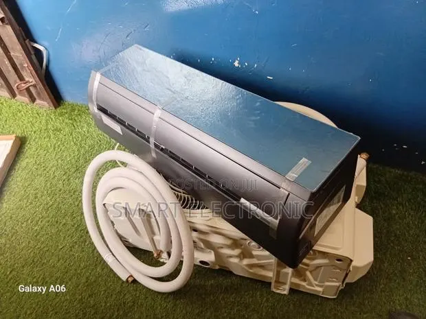 TCL 1.5hp Smart Inverter Ac With Mirror Design · Photo 1