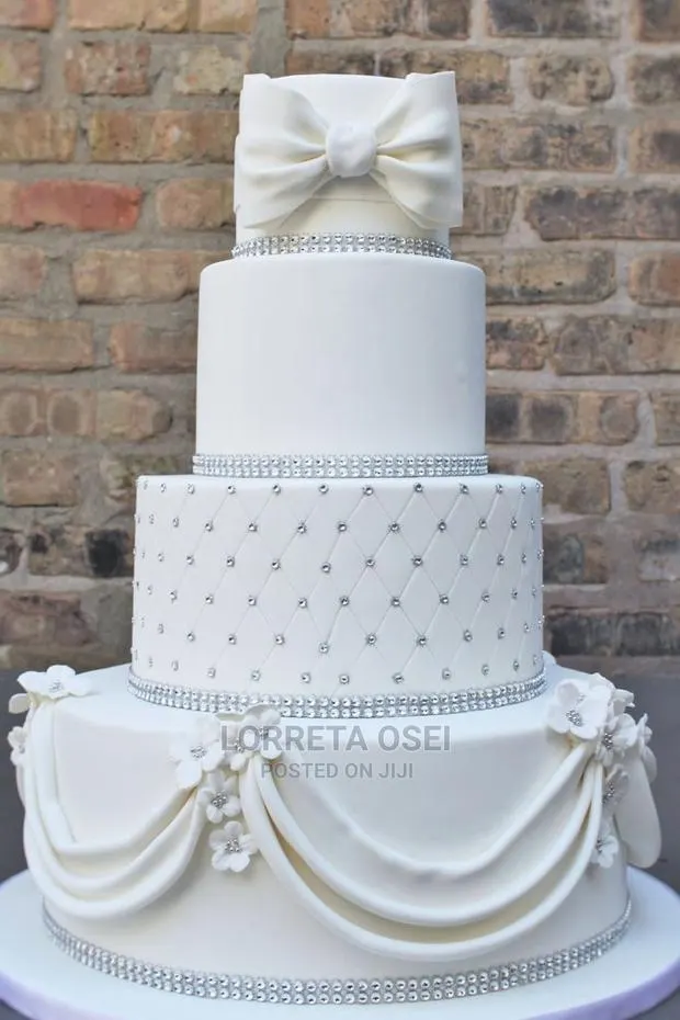 Four Tier White Wedding Cake · Photo 1