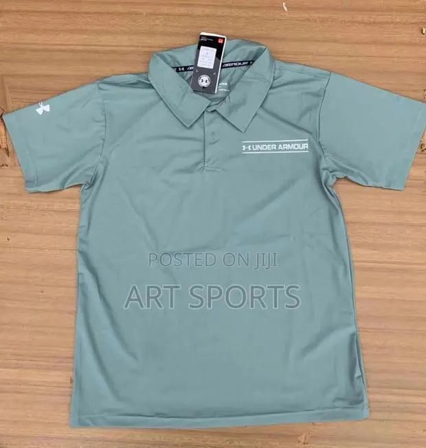 Under Amour Polo Top · Photo 1