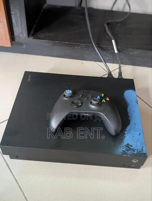 Xbox One X Console With Games and One Controller · Photo 1