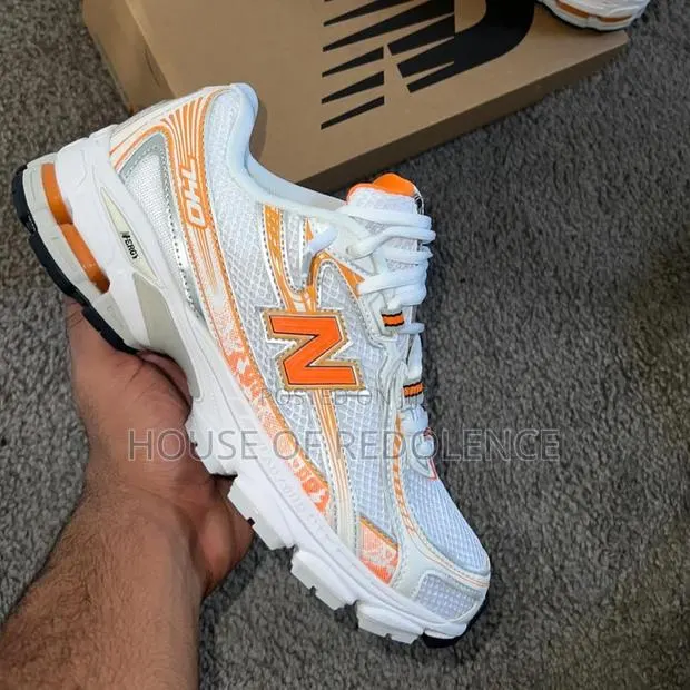 New Balance 740 Orange White Sneakers · Photo 1
