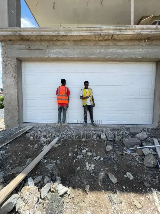 White Box Garage Door Automated · Photo 1