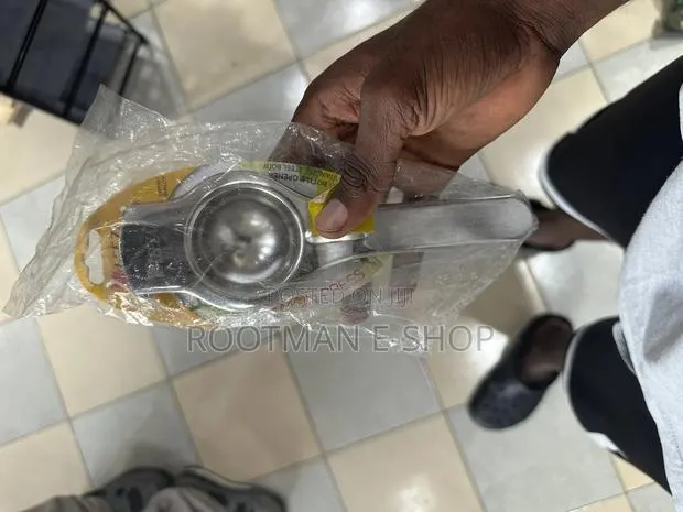 Generic Stainless Steel Manual Lemon Squeezer With a Bottle Opener · Photo 1
