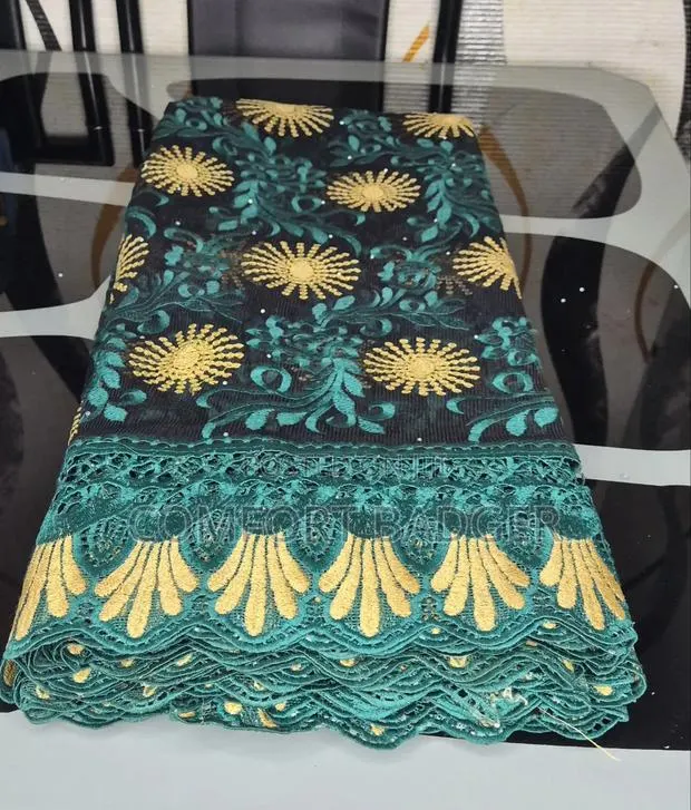 Black Mesh Lace With Teal Green and Gold Embroidery · Photo 1