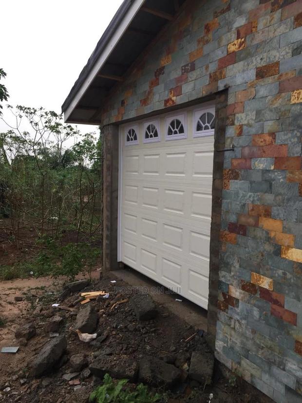 Automatic Garage Door With Backup Battery · Photo 3