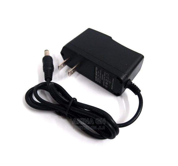 Power Adapter Ac/Dc 12V, 1A · Photo 1