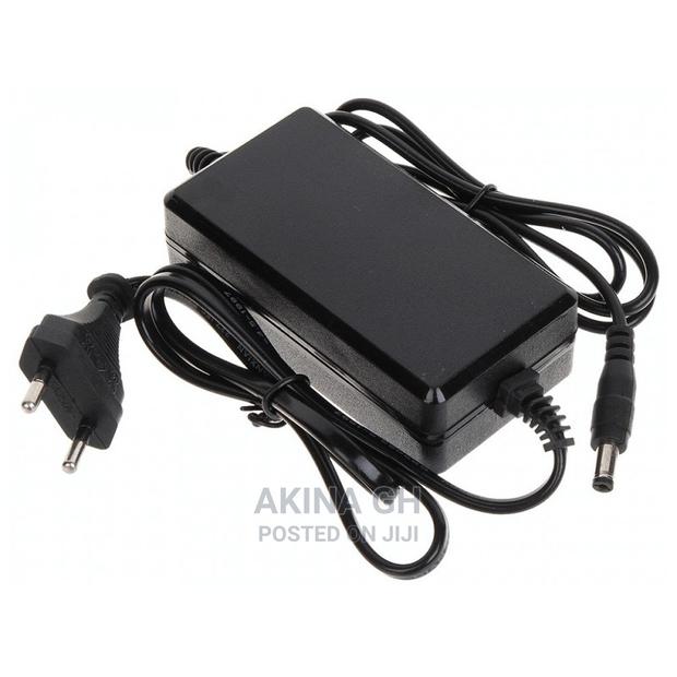 Power Adapter Ac/Dc 12V, 2A · Photo 1