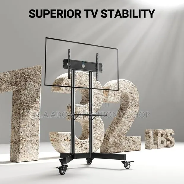 Floor Standing Tv for Tv Between 32”-70” · Photo 1