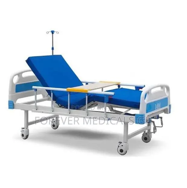 Hospital Bed 2 Crank With Mattress, Drip Stand and Overhead Table · Photo 1
