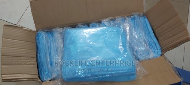Disposable Isolation Gowns · Photo 3