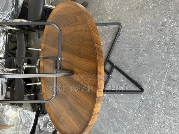 Modern Round Wooden Side Table With a Dark Finish Sleek Metal Frame · Photo 1