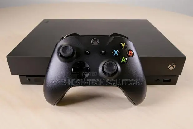 Xbox One X With 1 Controller and 16 Games · Photo 1