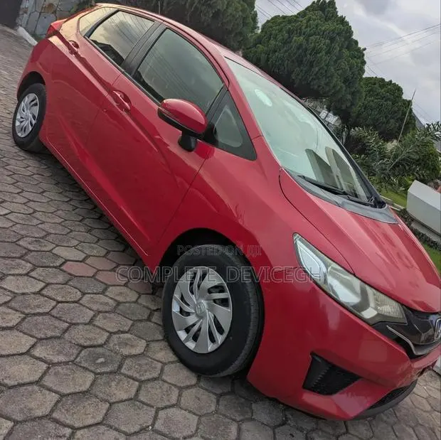 Honda Fit LX 4dr Hatchback (1.5L 4cyl CVT) 2015 Red · Photo 1