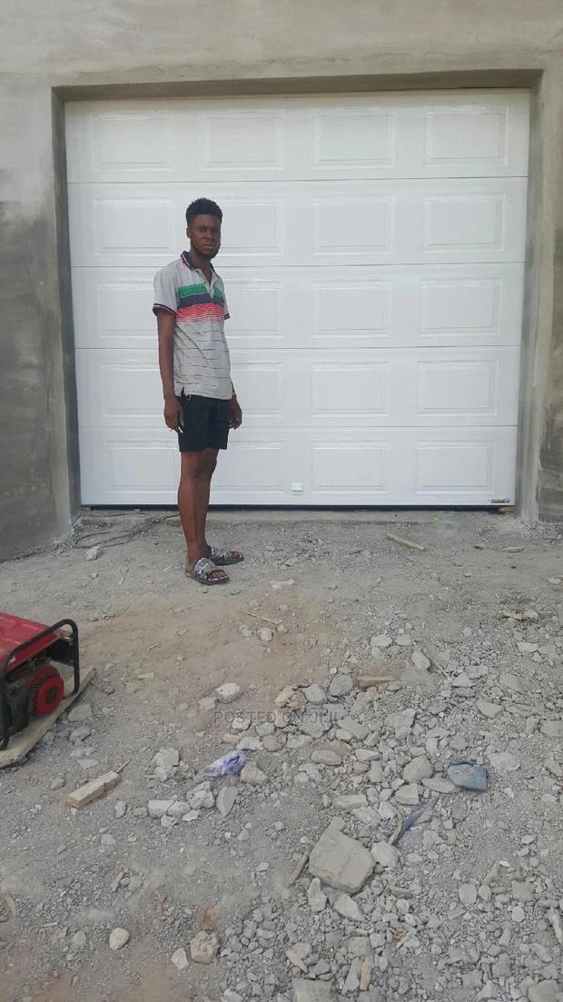 Automatic Garage Door With Backup Battery · Photo 2