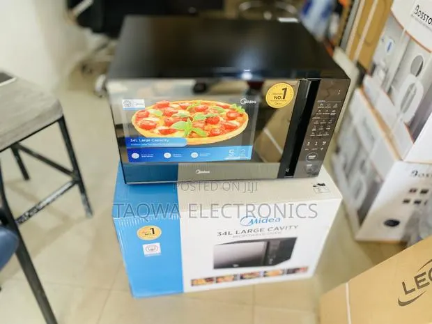 New 34 -Litres Midea Microwave · Photo 1