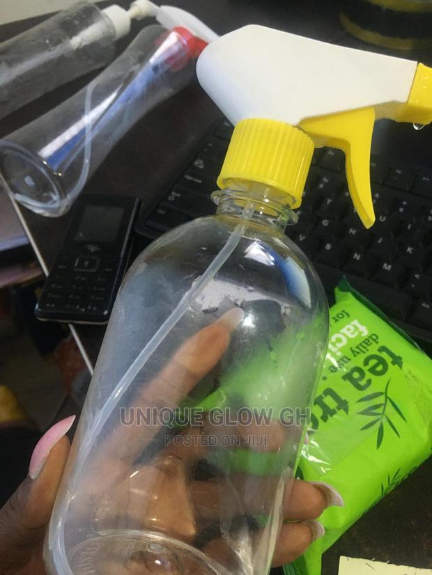 Spraying Rubbing Liquid Sanitizer Bottles With Sprayer · Photo 3
