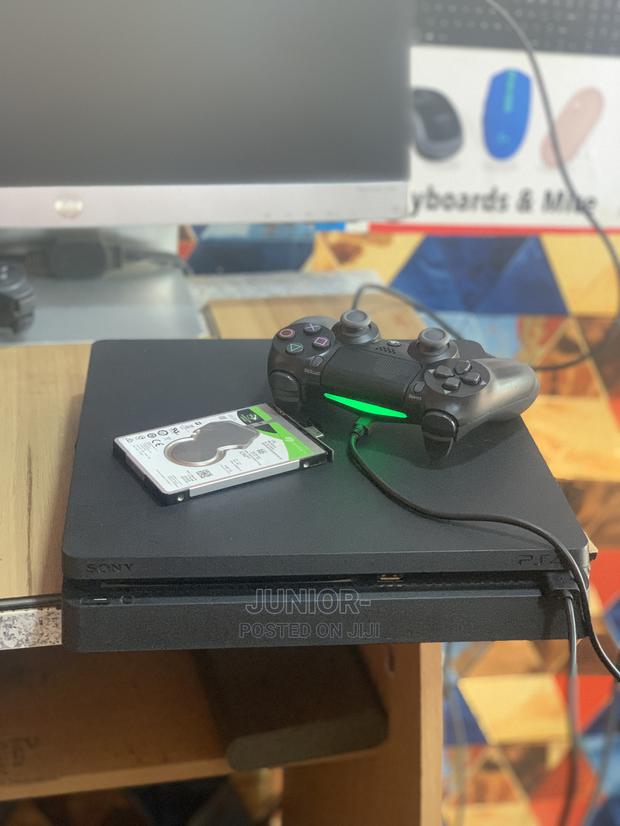 Neat Playstation 4 Slim With Games · Photo 2