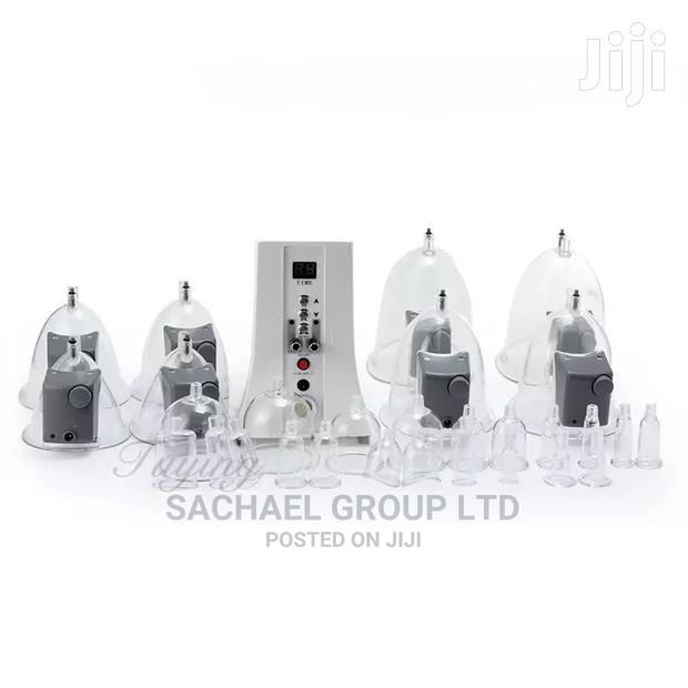 Therapy Massaging Cups and Machine · Photo 1