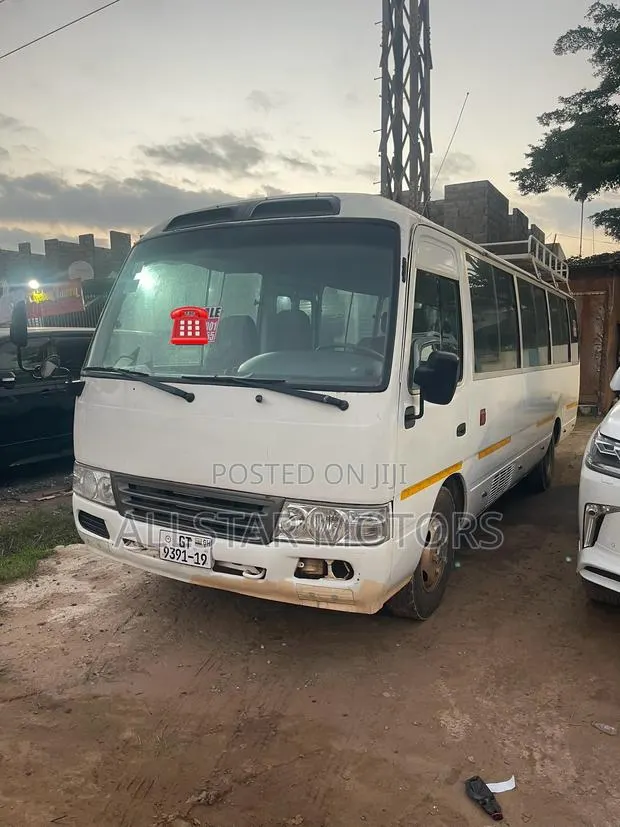 Toyota Coaster 2009 White · Photo 1
