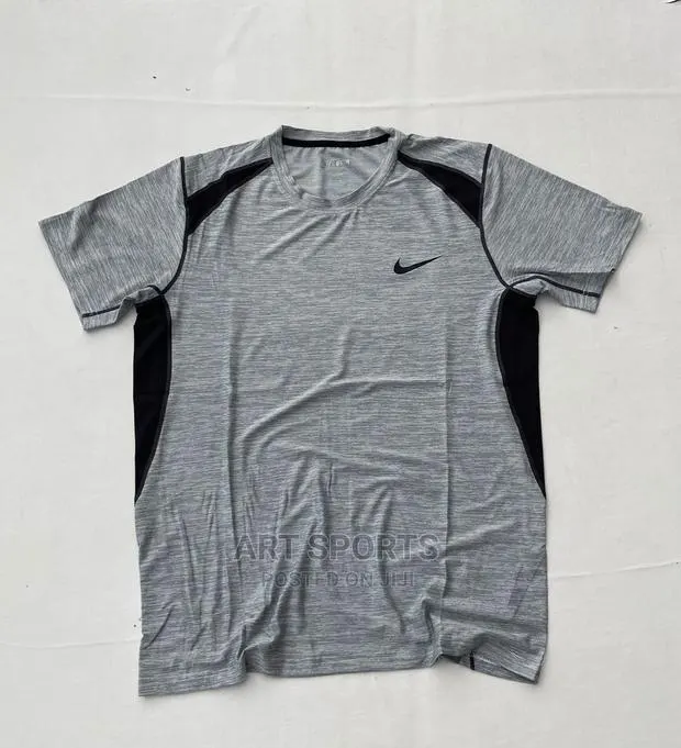 Nike Tops . · Photo 1