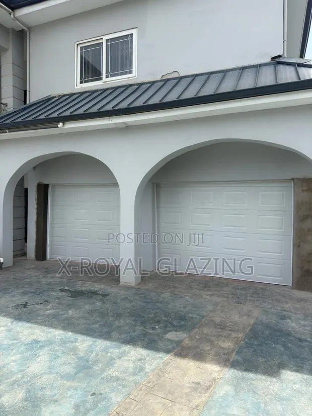 Double Face Remote Control White Garage Door Well Installed · Photo 1