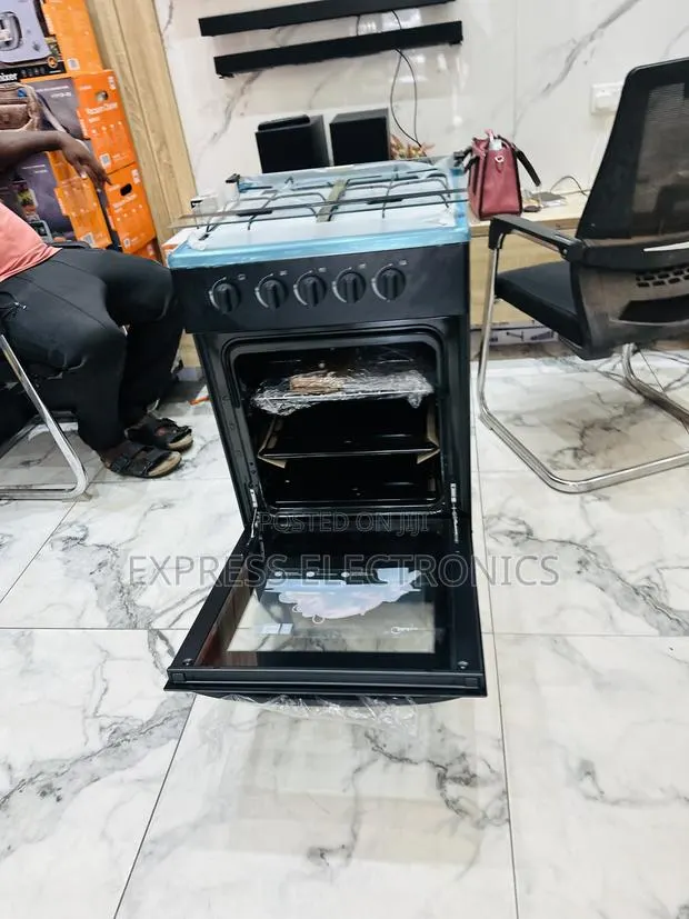 Newly in Box Gas Cooker Oven 4b 50/50 Gas Cooker Midea Black · Photo 1