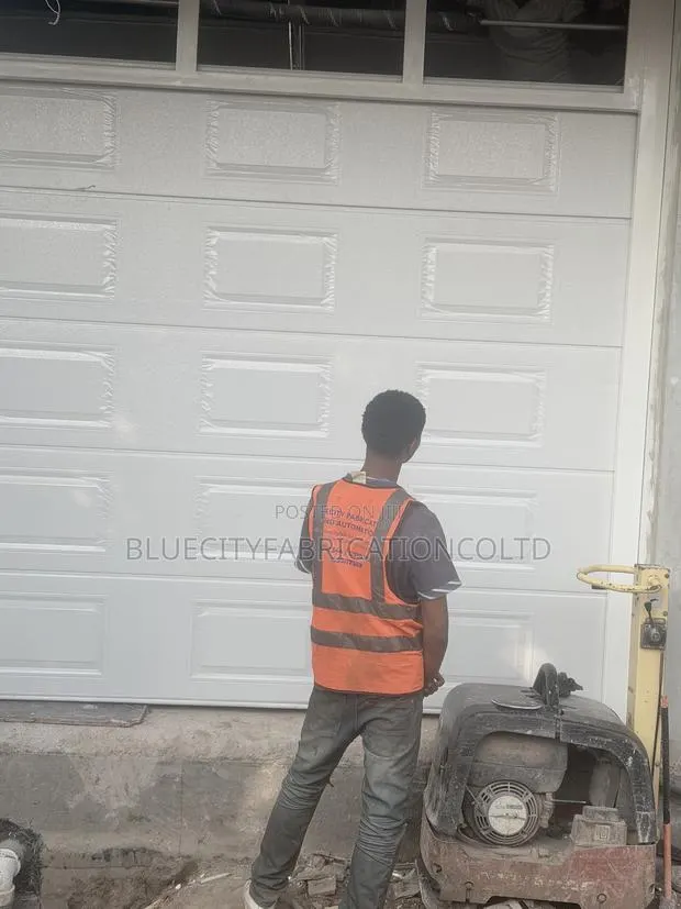 Double Panel Garage Door · Photo 1