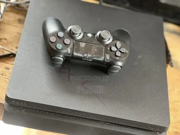 Playstation 4 Slim With Games Loaded · Photo 1