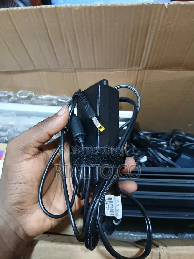Lenovo AC Slim Tip Adapter (Rectangular W/ a Yellow Pin) Connector. · Photo 1