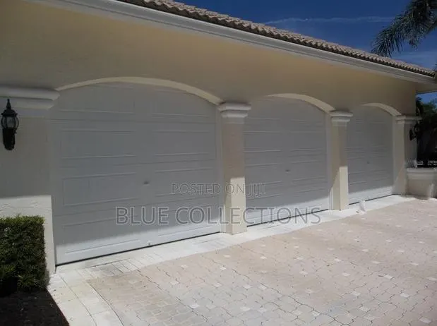 Triple Automated Garage Doors · Photo 1