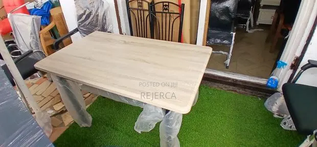 Durable Dinning Table With 4 Chairs · Photo 1